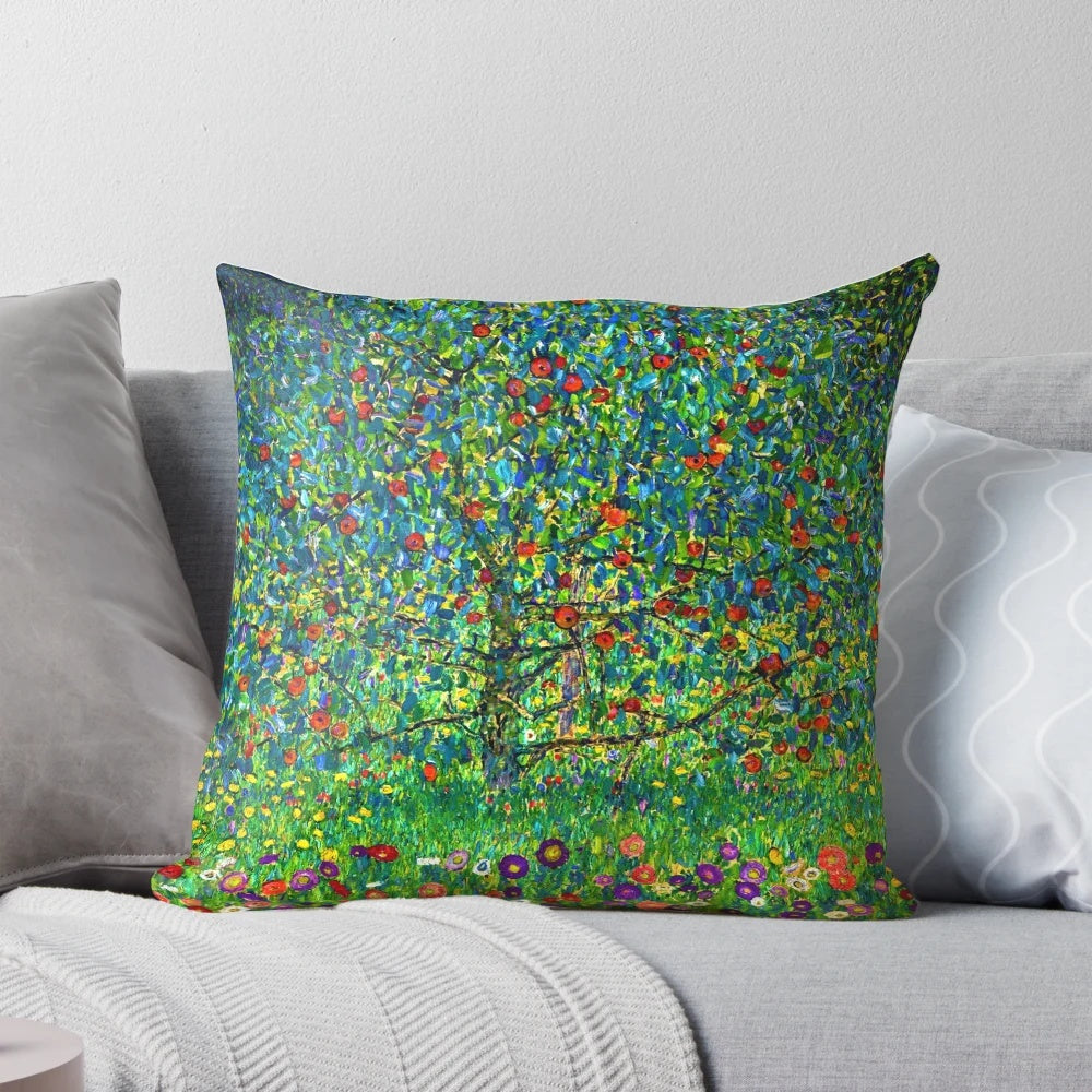 Gustav Klimt's famous "Apple Tree I" landscape painting featured on a decorative pillow