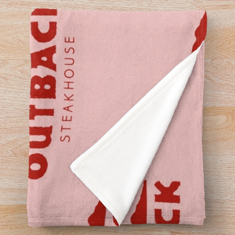 Outback Steakhouse-themed plush blanket with restaurant logo and food imagery