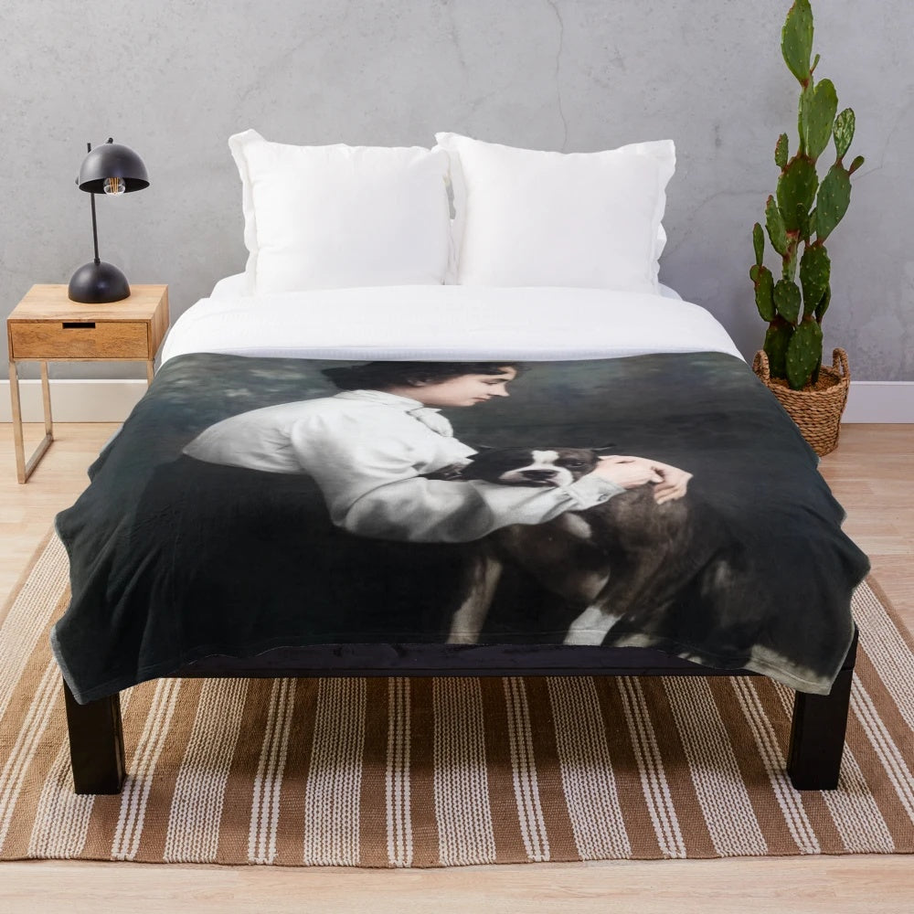 Colorized image of Helen Keller and her guide dog on a plush blanket