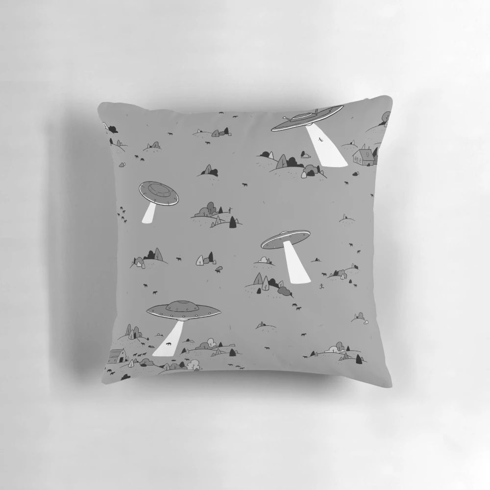Vintage-inspired throw pillow with a UFO and alien abduction design