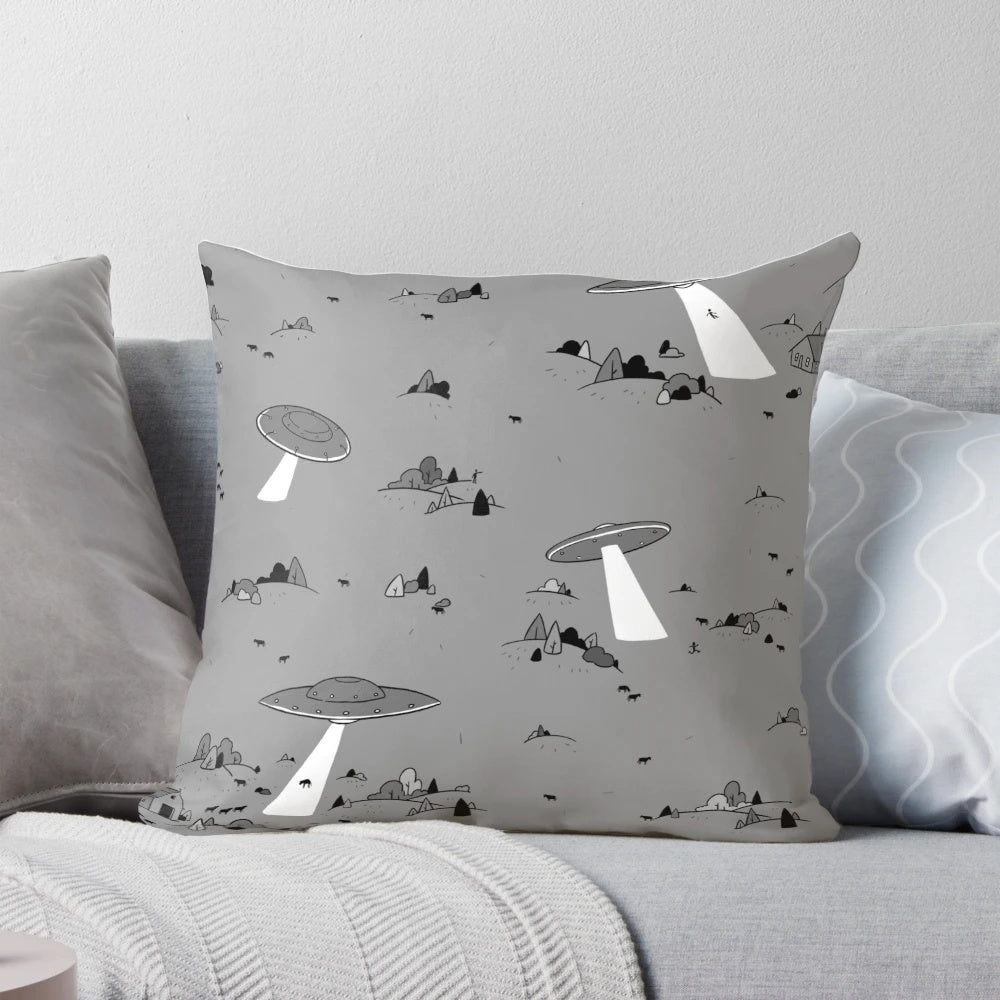 Vintage-inspired throw pillow with a UFO and alien abduction design