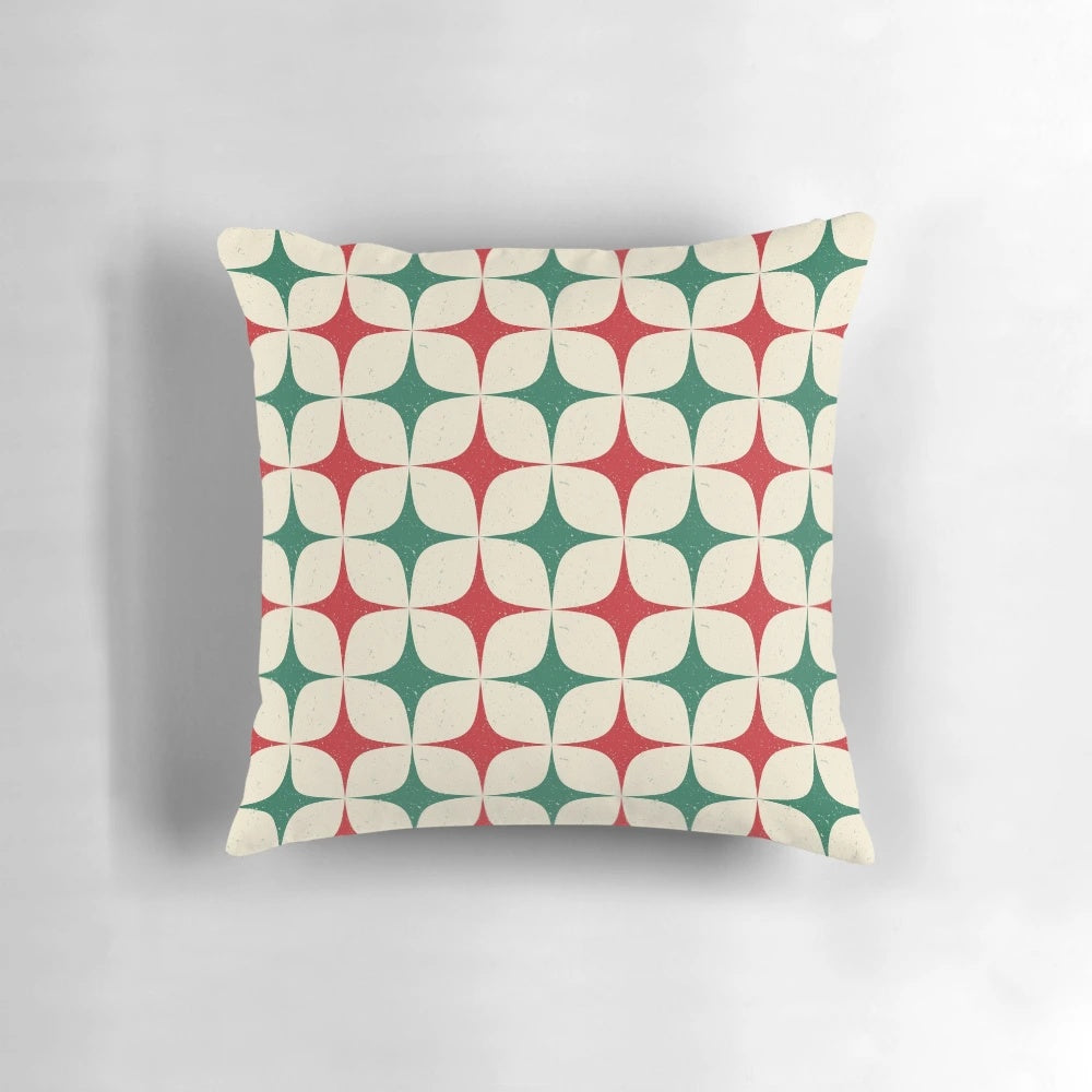 Vibrant 1960s-inspired geometric pattern pillow in shades of red, green, and white