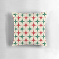 Vibrant 1960s-inspired geometric pattern pillow in shades of red, green, and white