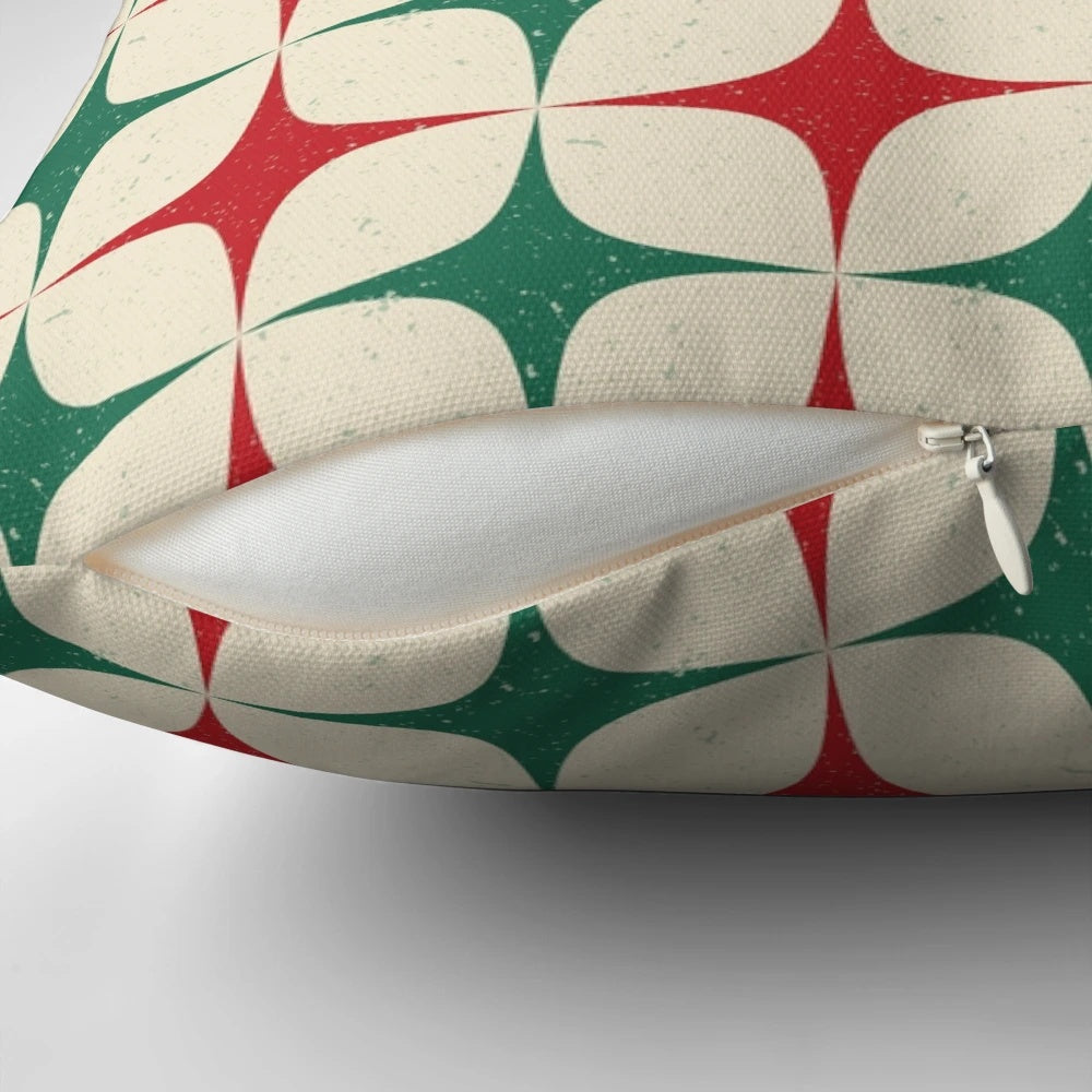 Vibrant 1960s-inspired geometric pattern pillow in shades of red, green, and white