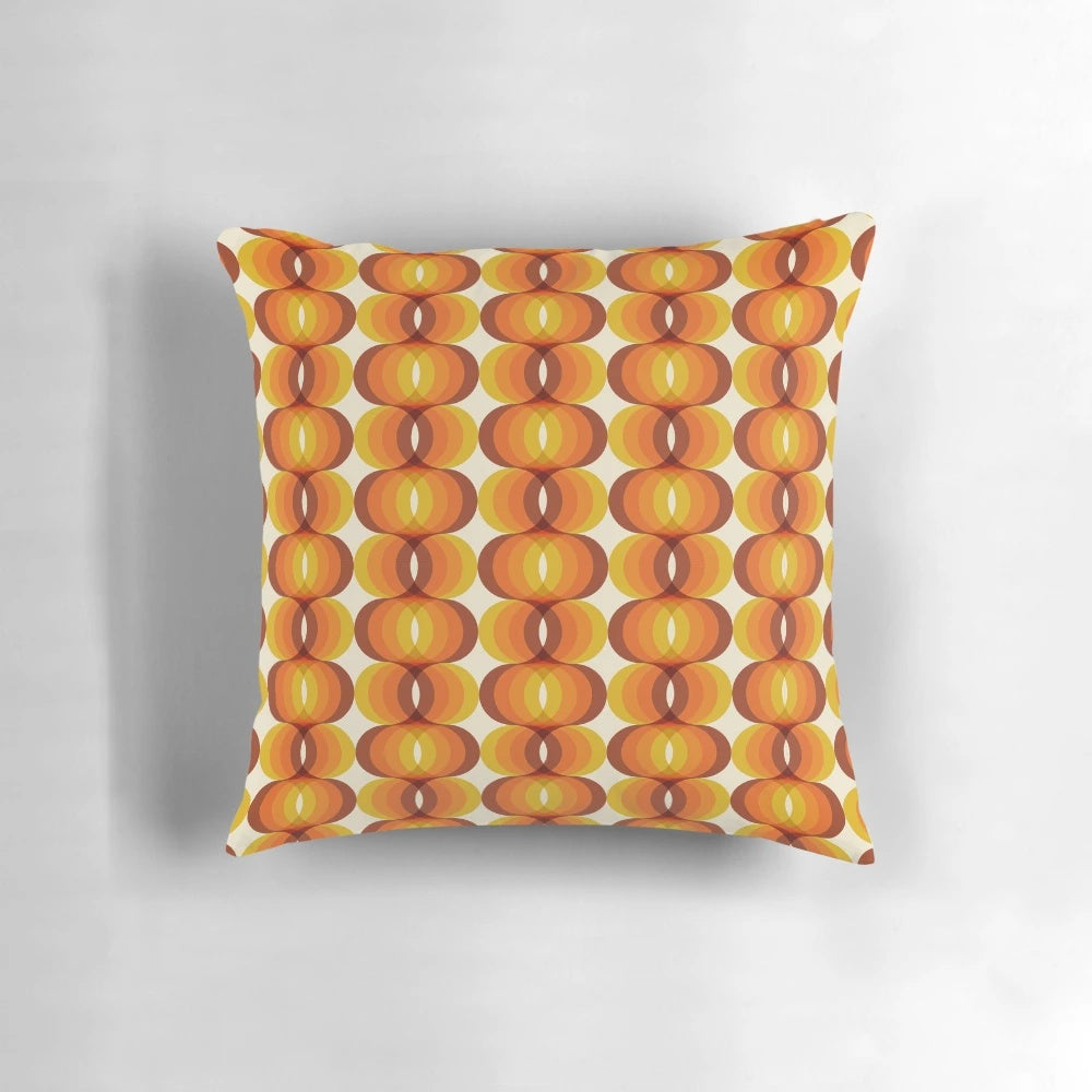Retro 1960s wavy geometric pattern throw pillow in brown, orange, and ivory colors