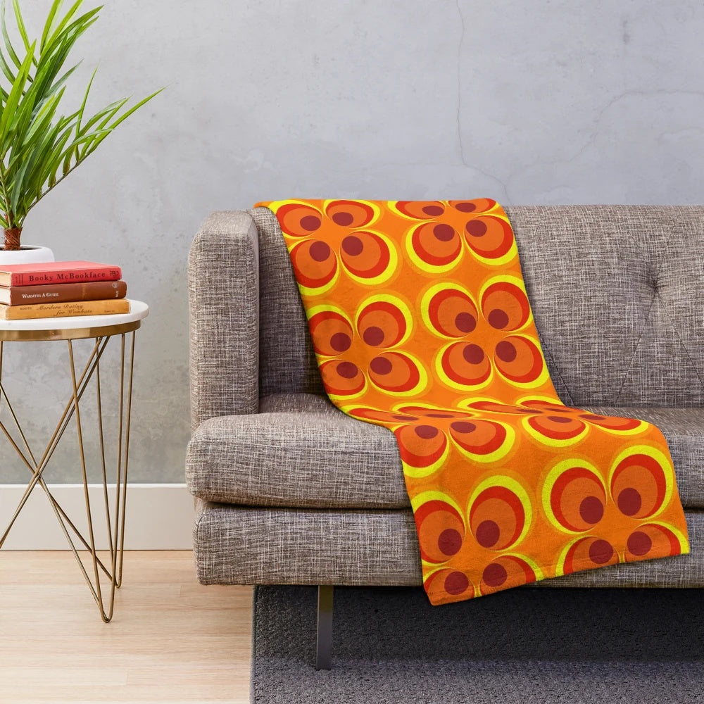 Cozy 1970s style burnt orange and geometric pattern plush blanket