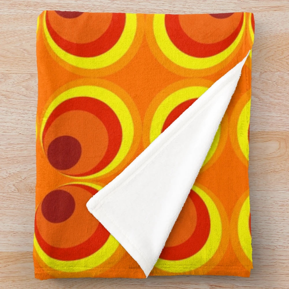 Cozy 1970s style burnt orange and geometric pattern plush blanket