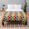 Retro 1970s plush blanket with a vibrant geometric pattern