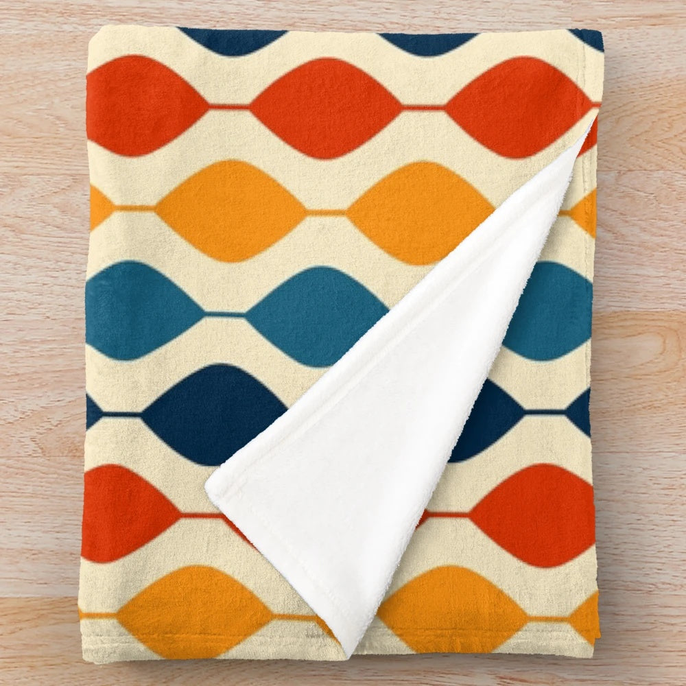 Retro 1970s plush blanket with a vibrant geometric pattern
