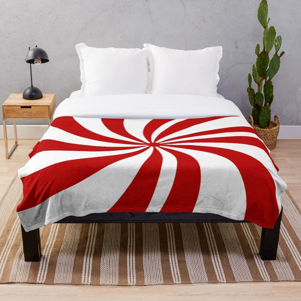 Vintage 1980s style red and white striped plush Christmas blanket with a candy cane pattern