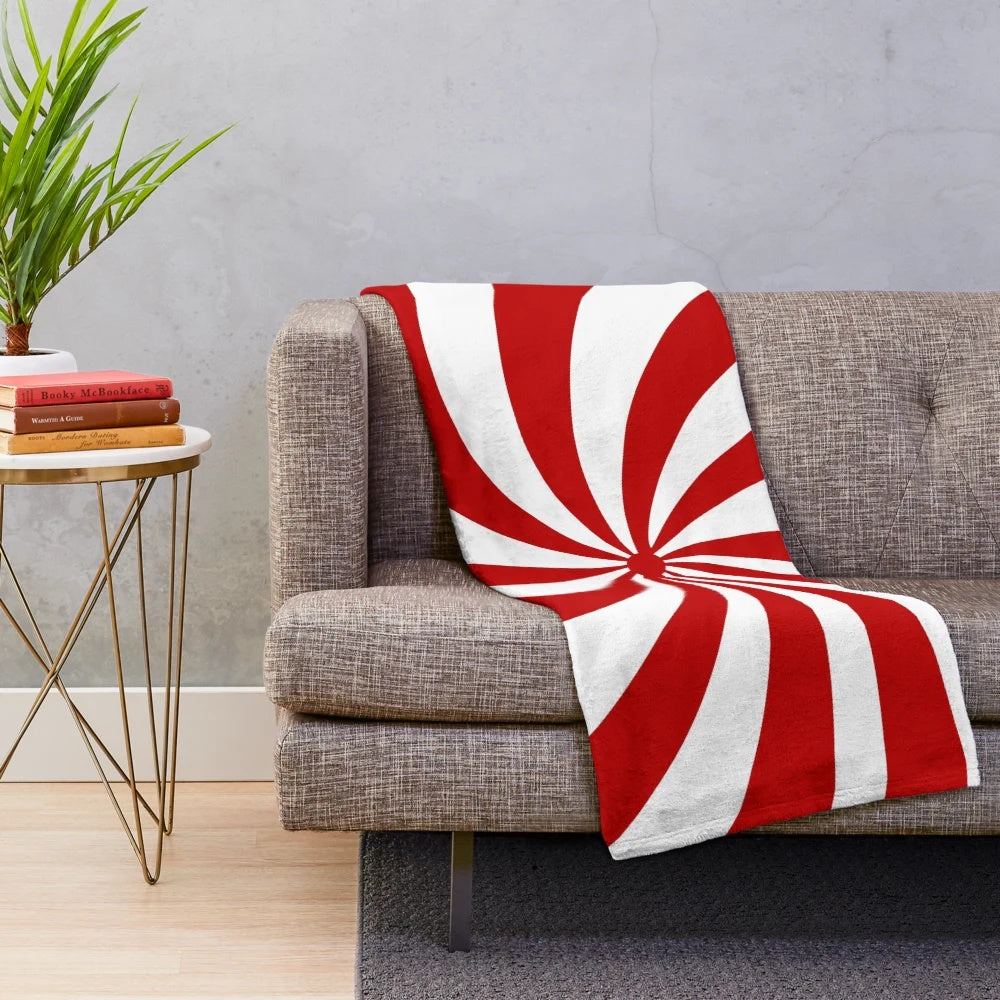 Vintage 1980s style red and white striped plush Christmas blanket with a candy cane pattern