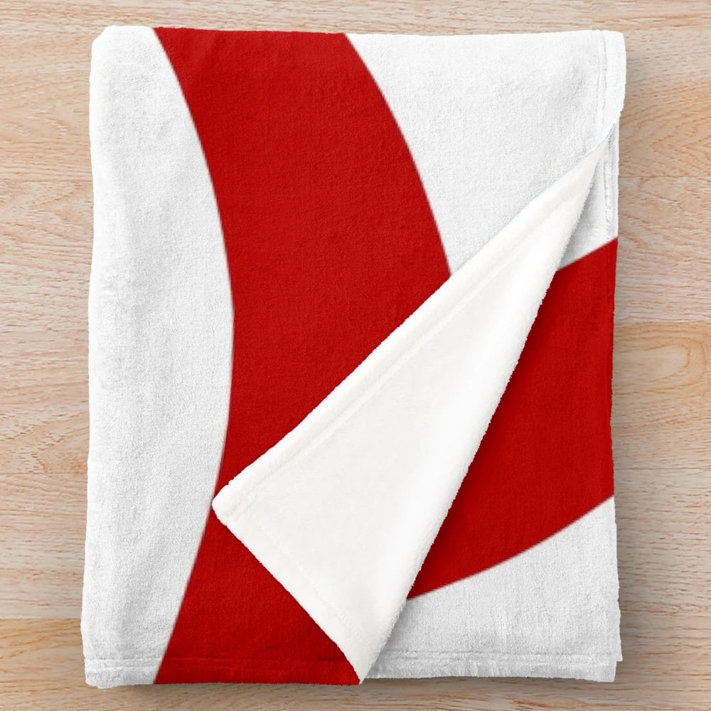 Vintage 1980s style red and white striped plush Christmas blanket with a candy cane pattern