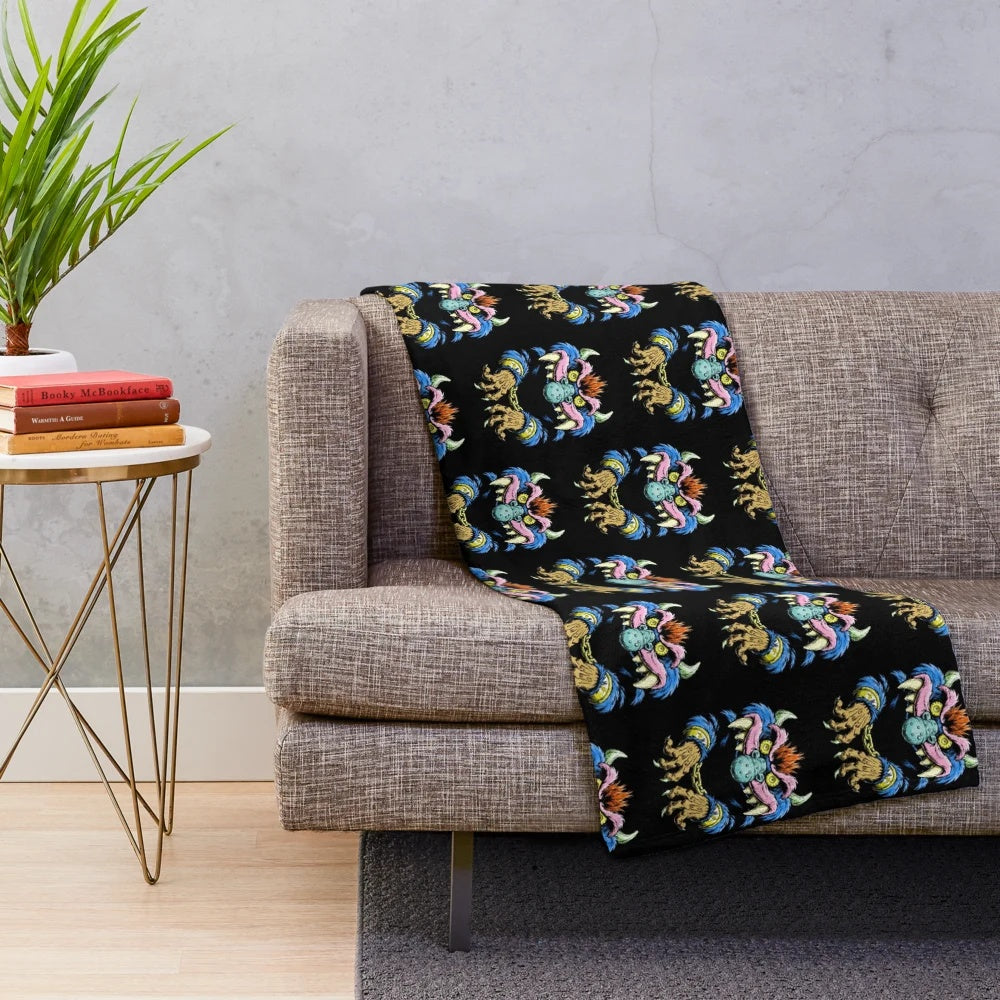 Retro 1980s monster plush blanket with vibrant monster artwork