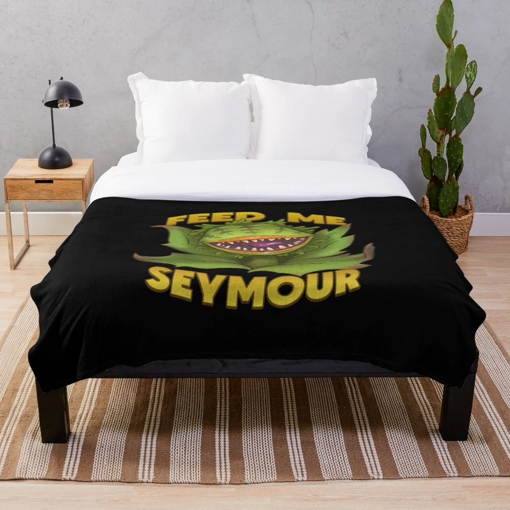 Retro 1980s plush blanket with Audrey II the plant from the cult classic film Little Shop of Horrors