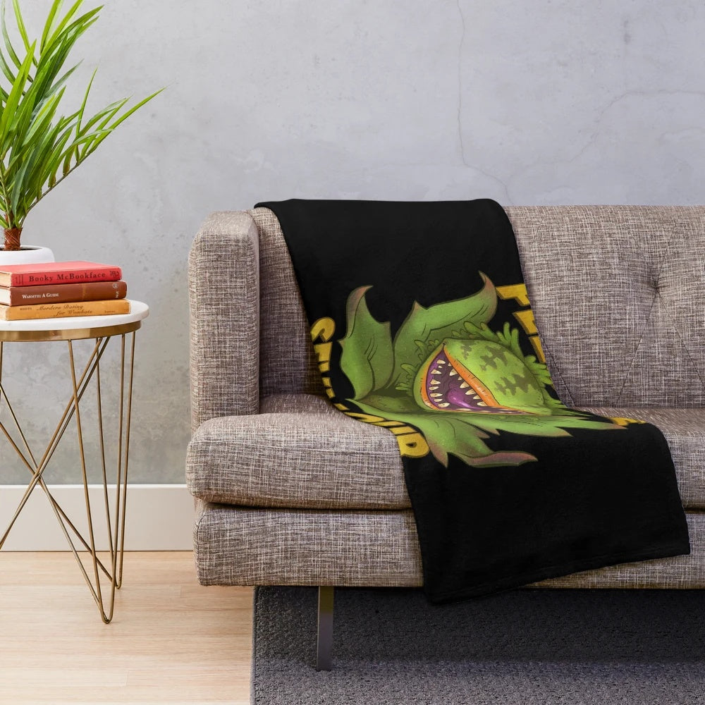 Retro 1980s plush blanket with Audrey II the plant from the cult classic film Little Shop of Horrors