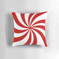 Festive holiday throw pillow with vintage 1980s inspired red and white candy cane swirl pattern