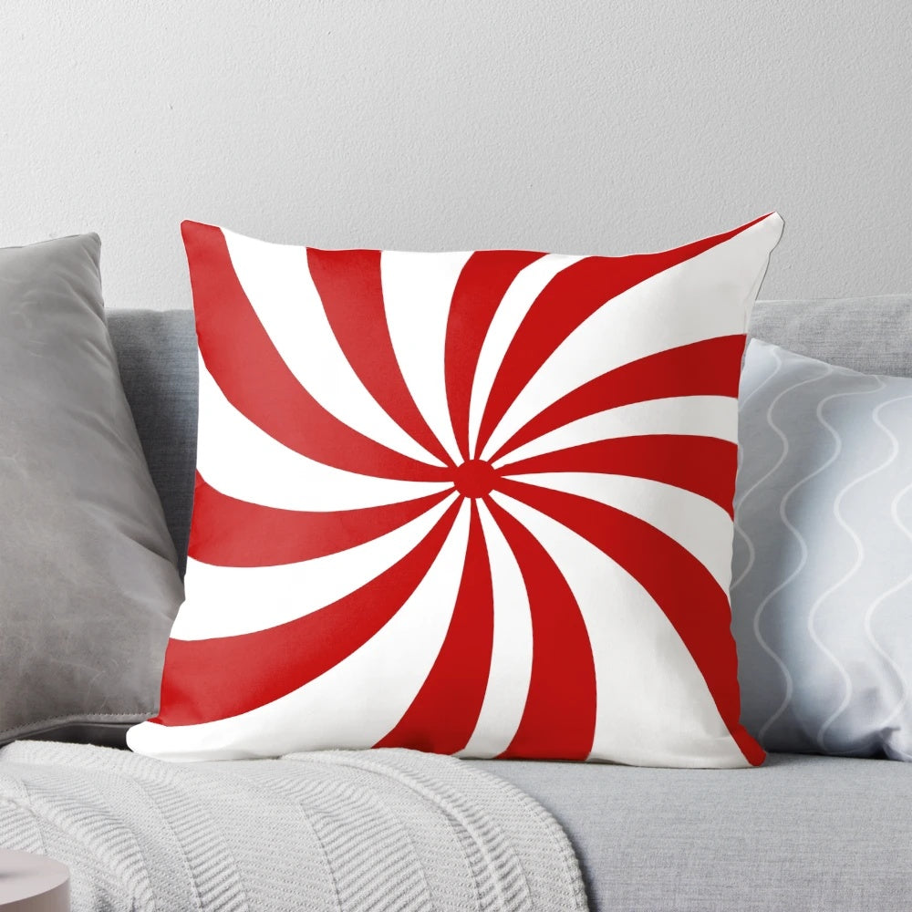 Festive holiday throw pillow with vintage 1980s inspired red and white candy cane swirl pattern