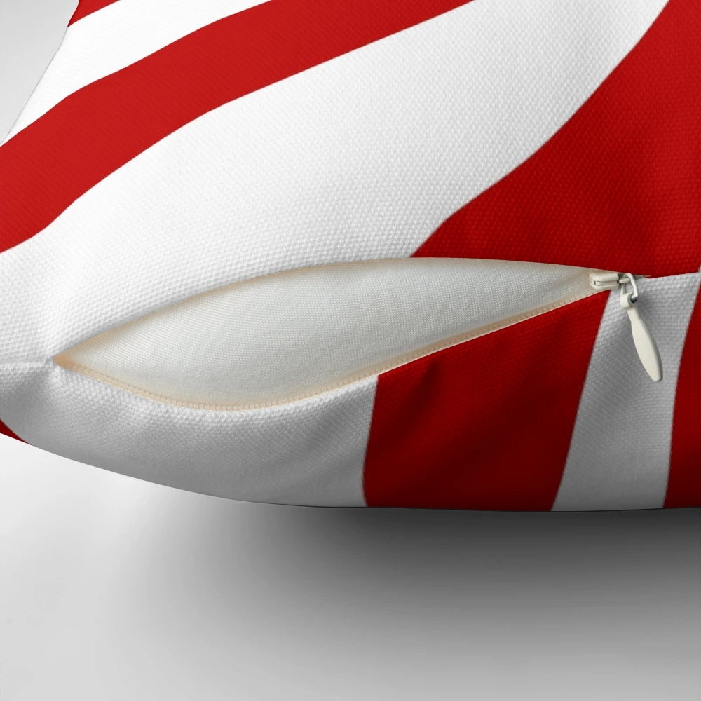 Festive holiday throw pillow with vintage 1980s inspired red and white candy cane swirl pattern