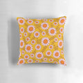 Vibrant pillow featuring a retro 70s daisy flowers botanical pattern in orange and pink tones