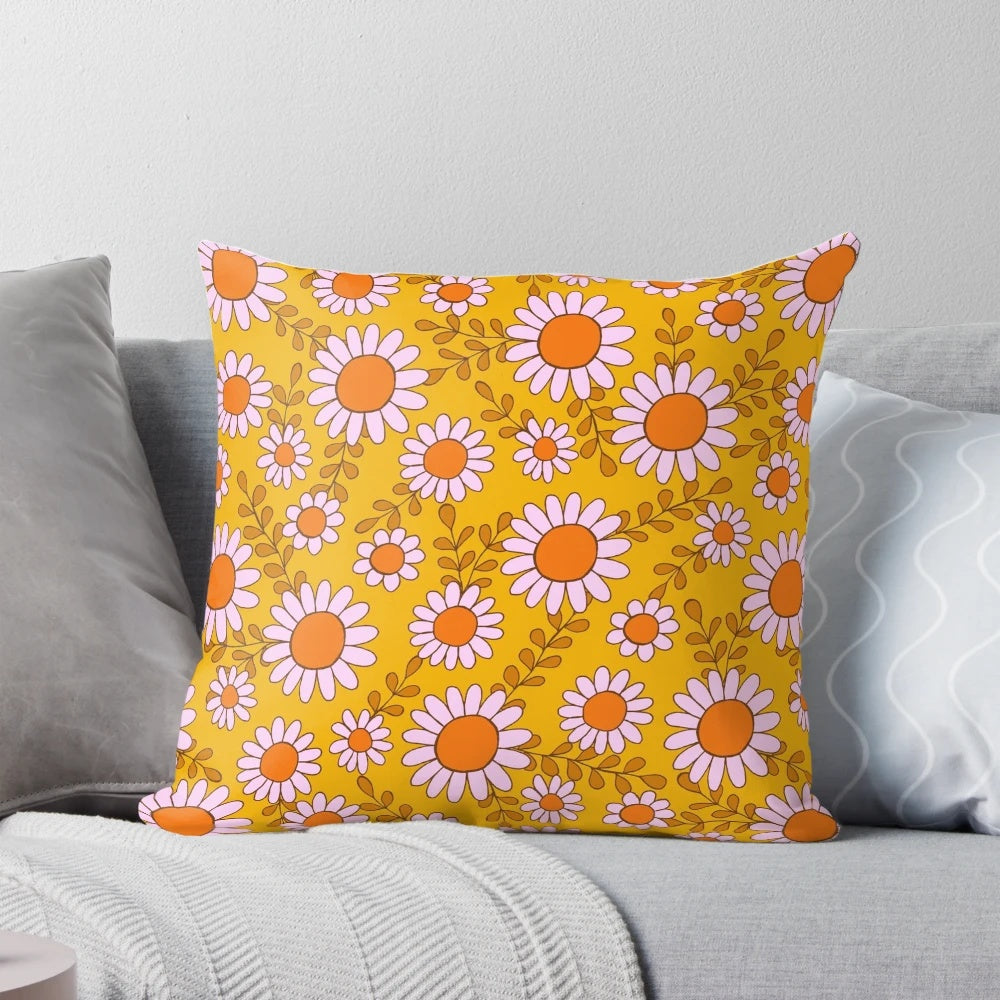 Vibrant pillow featuring a retro 70s daisy flowers botanical pattern in orange and pink tones
