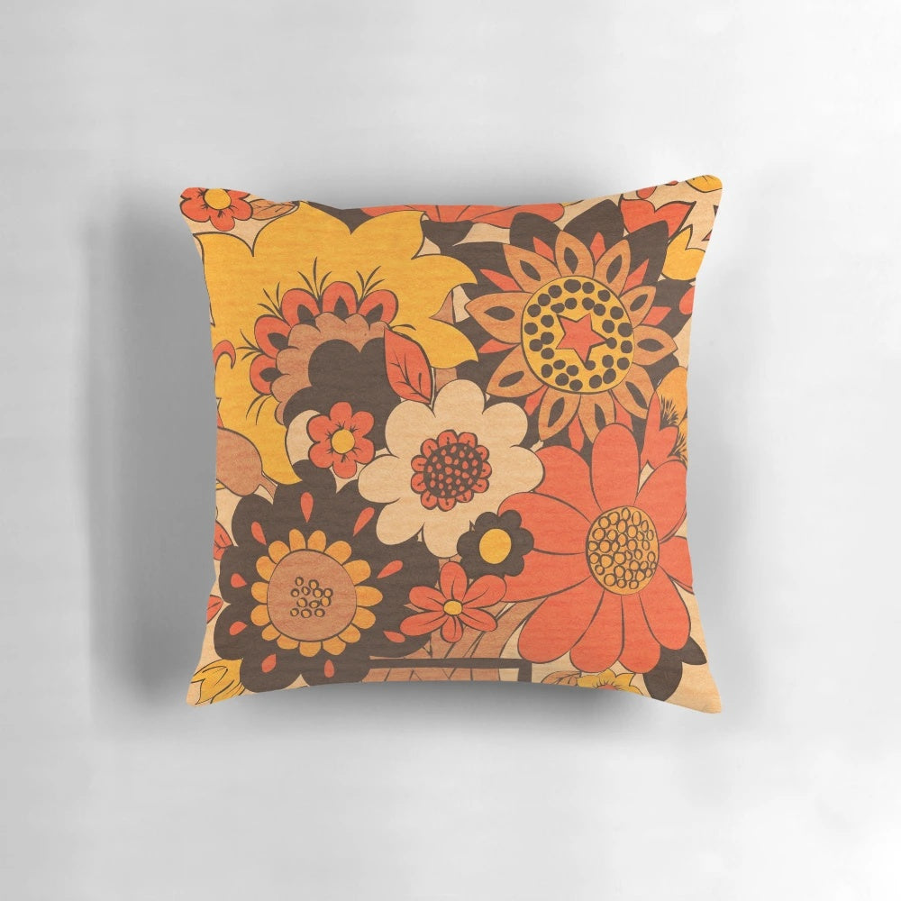Retro 70s flower vase print on a soft, comfortable pillow in shades of orange, yellow, and brown.