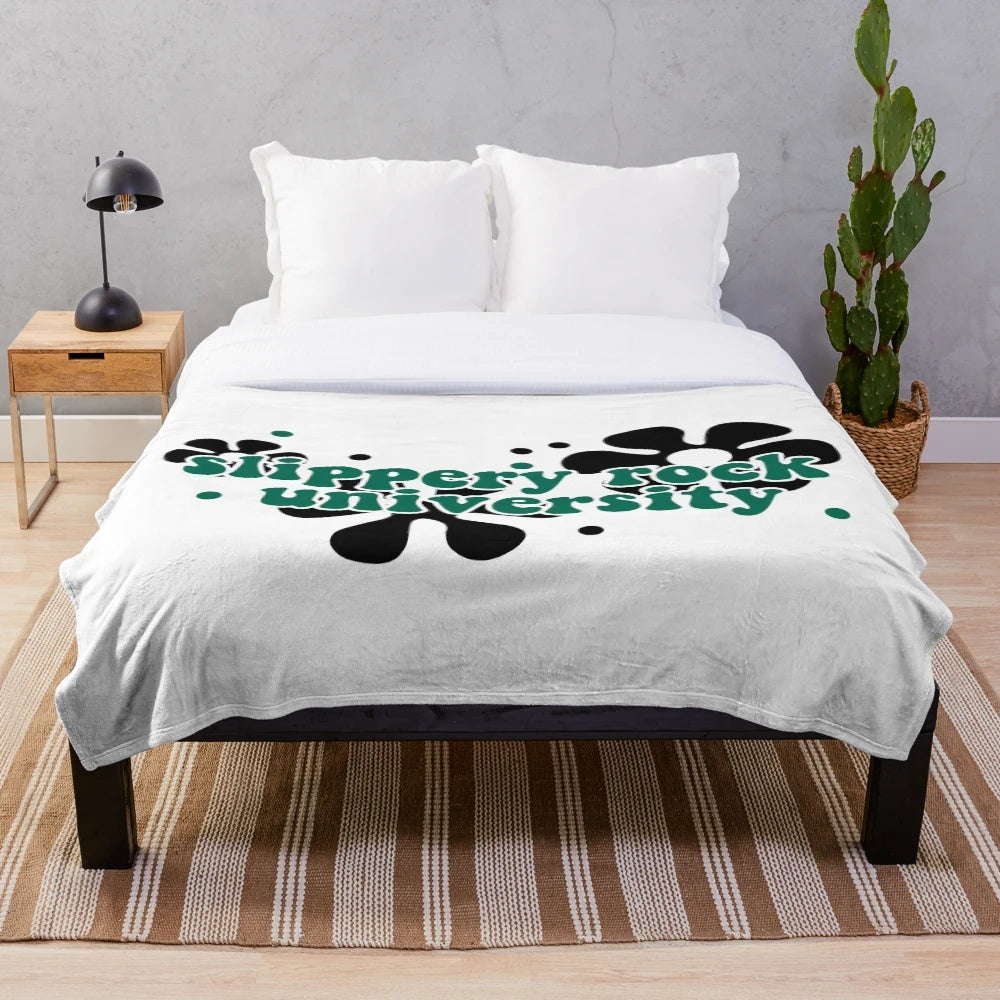 Retro 70s style plush blanket with Slippery Rock University inspired design