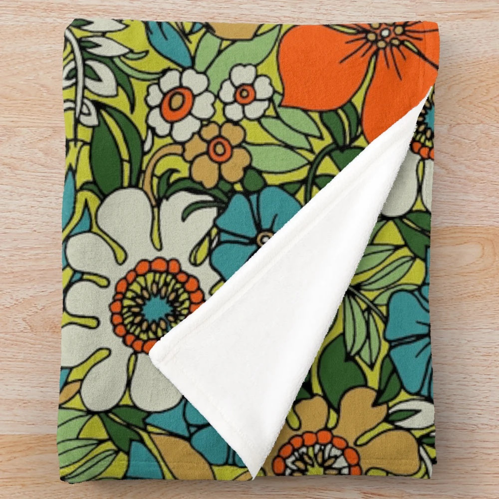Vibrant and retro 70s style plush floral blanket