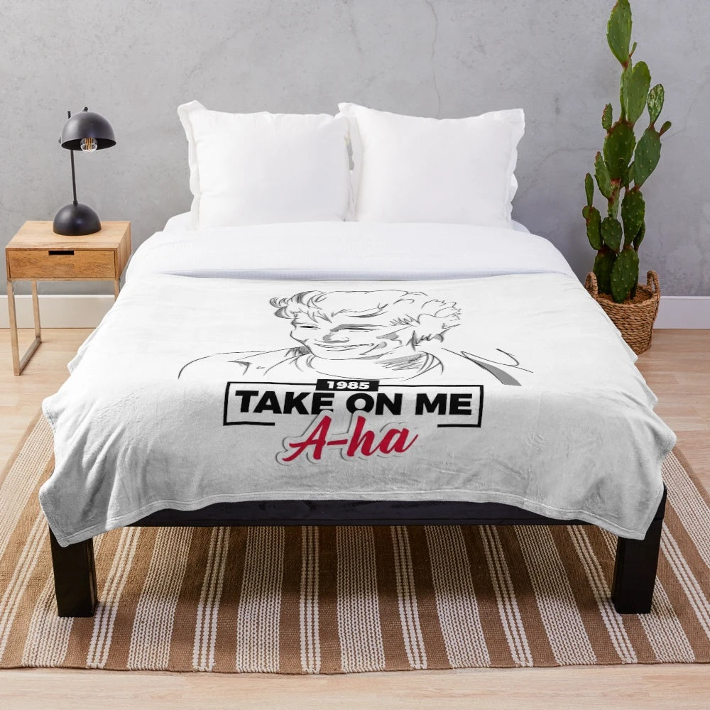 Soft plush blanket featuring the iconic "Take On Me" music video design from the 80s band A-ha