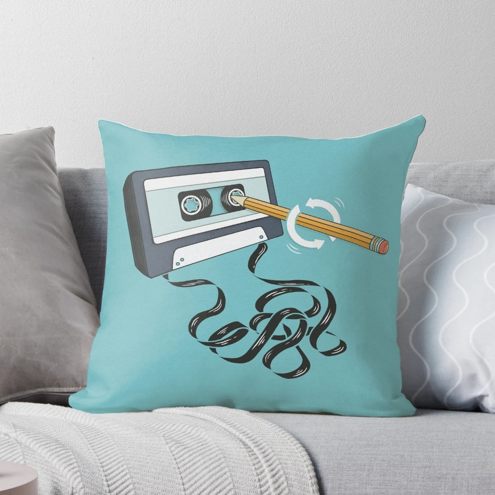 A blue and teal retro 80s cassette tape shaped pillow, a nostalgic home accessory for music lovers.