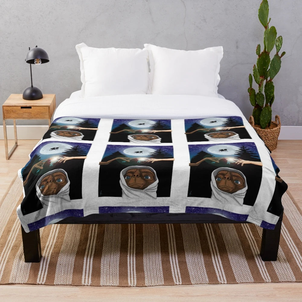 Plush blanket featuring the iconic E.T. the Extra-Terrestrial movie character