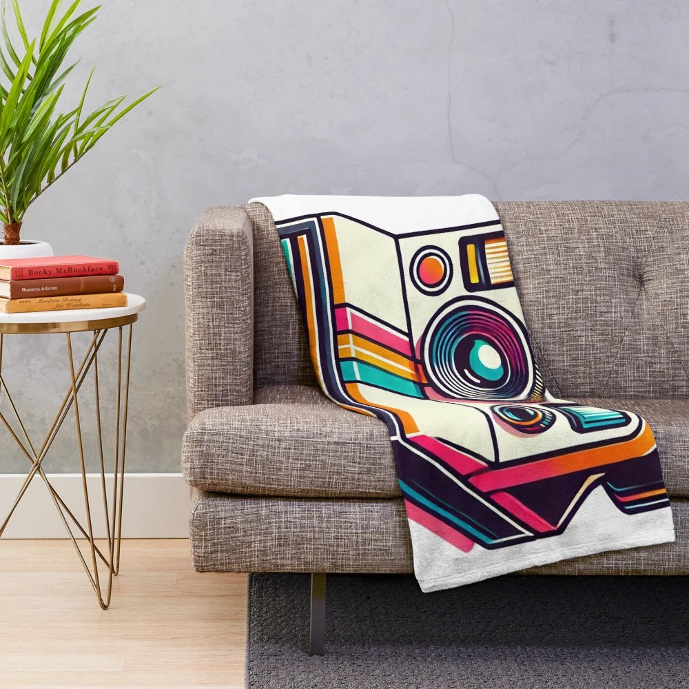 Vibrant plush blanket with classic 80s polaroid camera design