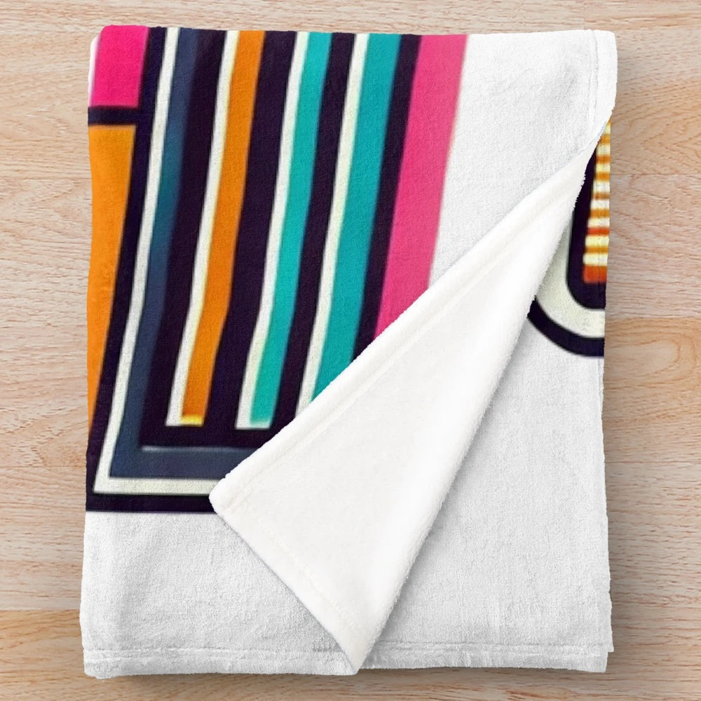 Vibrant plush blanket with classic 80s polaroid camera design