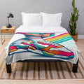 Colorful plush blanket featuring a retro 80s sneaker design
