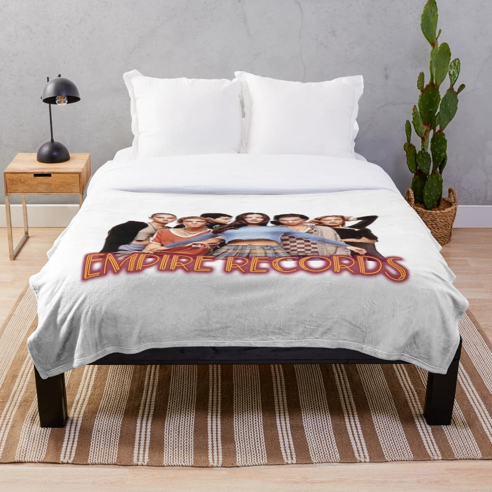Soft and cozy plush blanket featuring the iconic Empire Records movie logo and characters