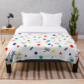 Soft, plush 90s-inspired blanket with colorful geometric squiggle pattern