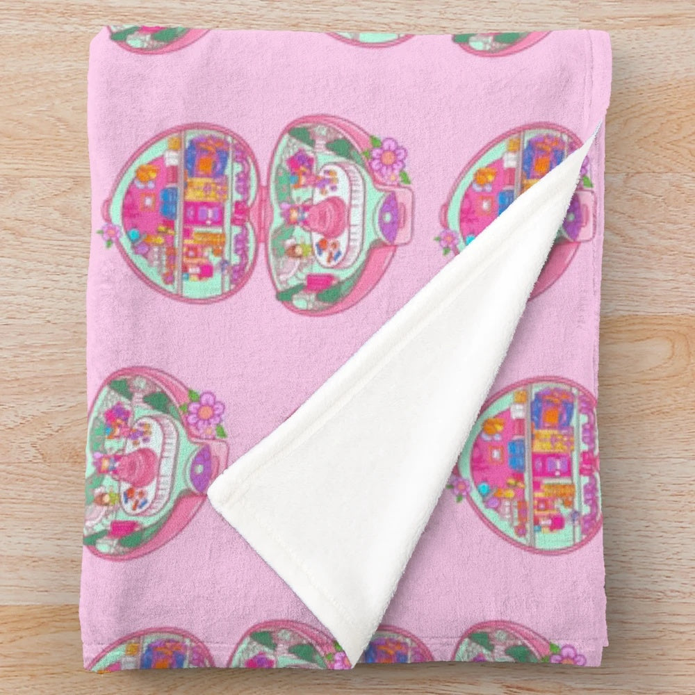 Retro 90s Polly Pocket themed plush blanket with birthday party decorations