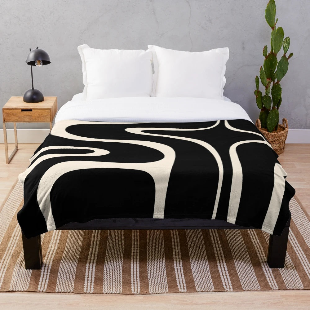 Retro abstract pattern plush blanket in black and almond cream colors