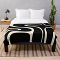 Retro abstract pattern plush blanket in black and almond cream colors