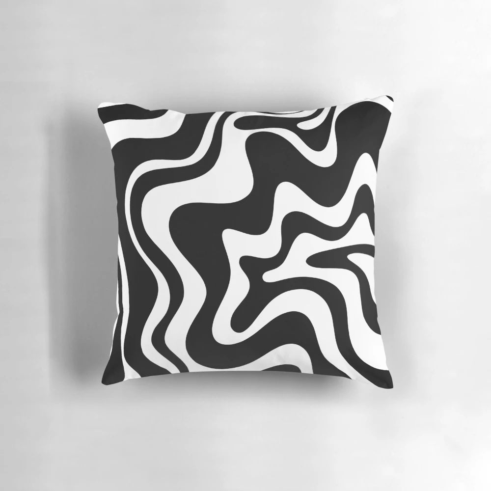 Decorative abstract swirl pattern black and white throw pillow for modern, boho, or minimalist home decor.