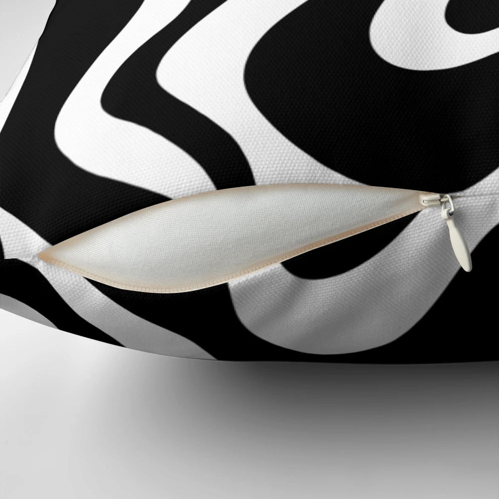 Decorative abstract swirl pattern black and white throw pillow for modern, boho, or minimalist home decor.
