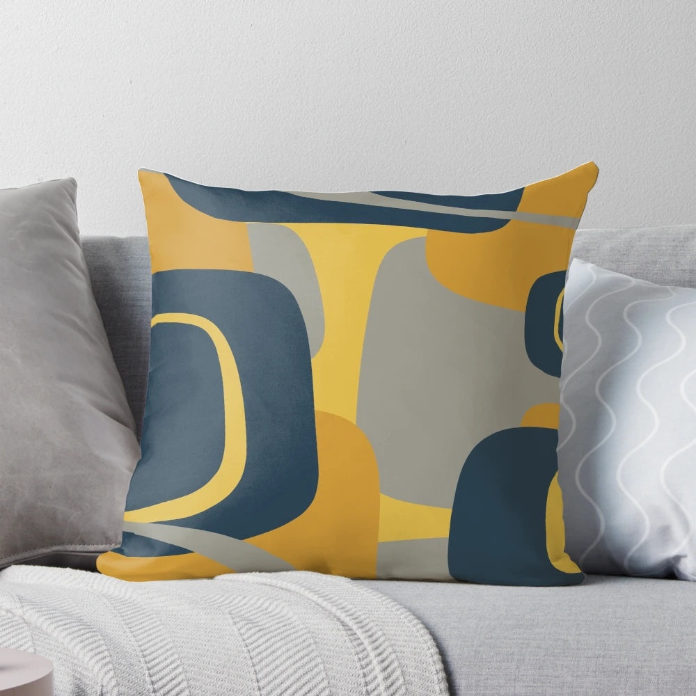 Decorative throw pillow featuring a retro abstract mid century modern pattern in navy blue, mustard yellow, and gray.