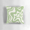 Retro abstract swirl pattern pillow in light sage green and cream colors