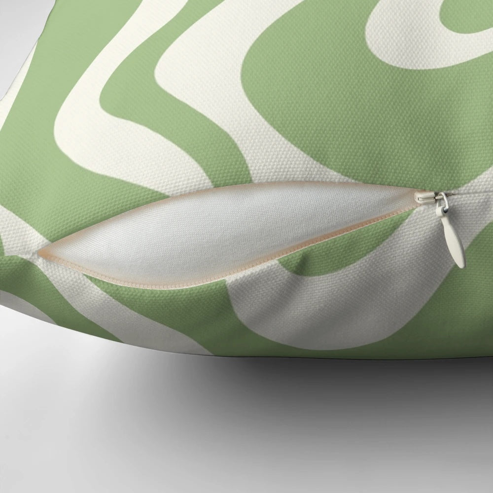 Retro abstract swirl pattern pillow in light sage green and cream colors