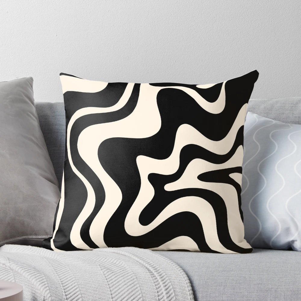 Retro abstract pillow with black and almond cream swirl pattern