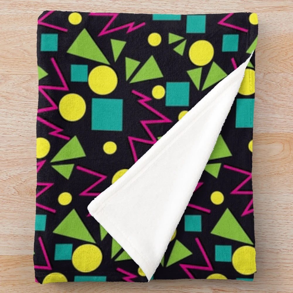 Plush blanket with a retro arcade-style carpet pattern, perfect for 90s gaming fans