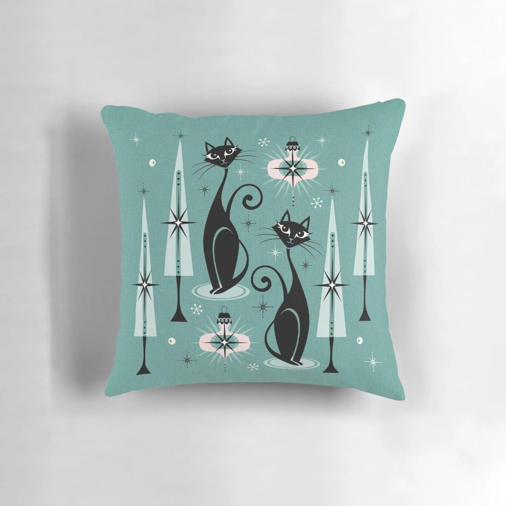 A vintage-inspired Christmas pillow featuring a stylized black cat in a mid-century modern atomic design.