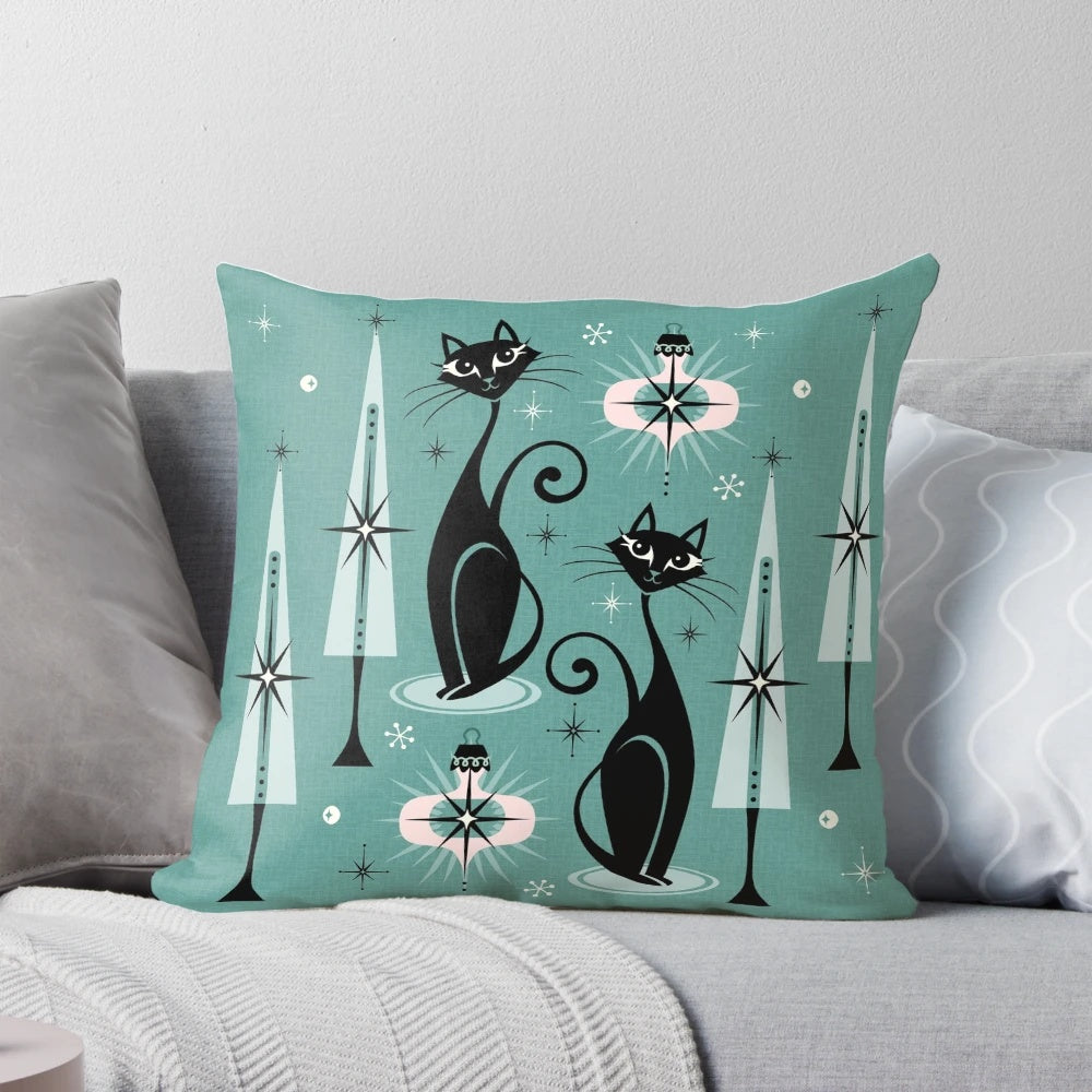 A vintage-inspired Christmas pillow featuring a stylized black cat in a mid-century modern atomic design.