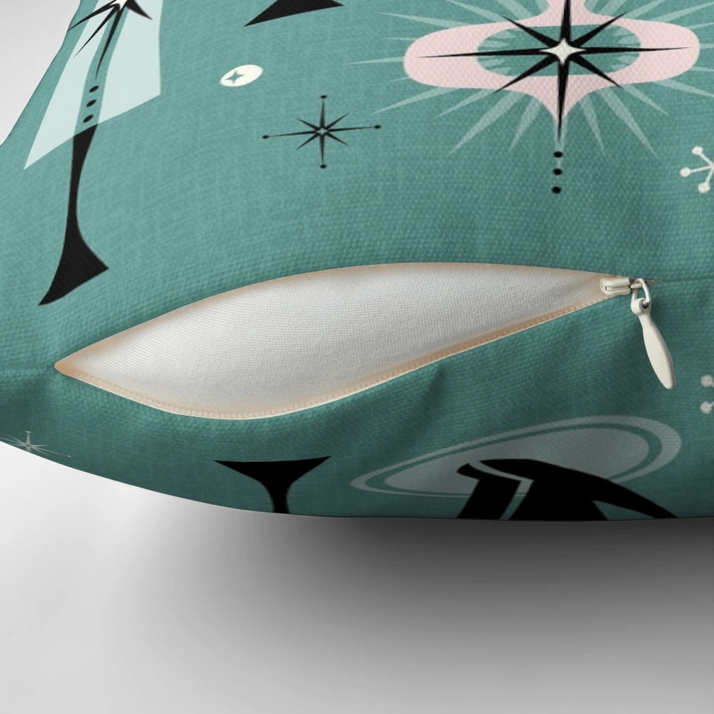 A vintage-inspired Christmas pillow featuring a stylized black cat in a mid-century modern atomic design.
