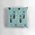 Mid-century modern blue pillow with a black and gray atomic cat design and starburst pattern