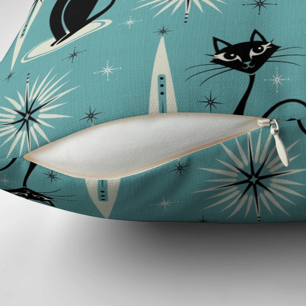 Mid-century modern blue pillow with a black and gray atomic cat design and starburst pattern